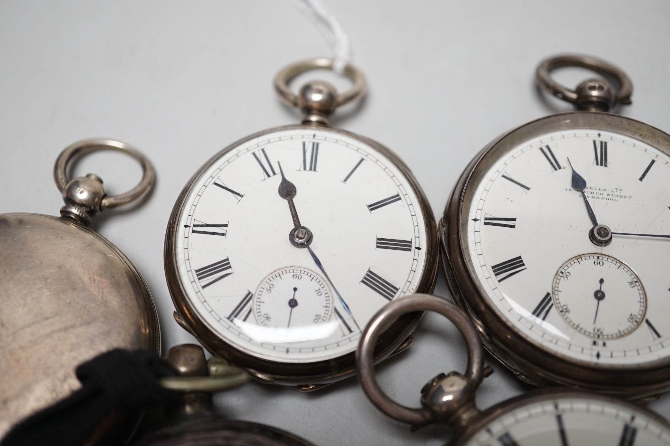 A 19th century silver pair cased keywind verge pocket watch, unsigned movement, together with three silver open faced keywind pocket watches including Fearn, Cornhill and a silver hunter pocket watch by Tanner of Lewes.